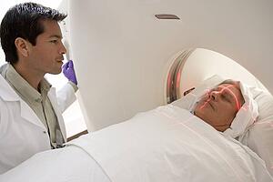 Doctor With Patient Having A Computerized Axial Tomography (CAT) Scan