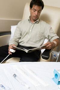 Patient Reading A Magazine While Being Monitored