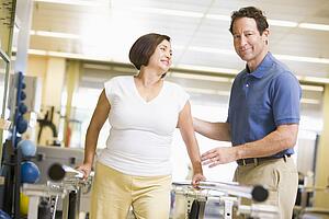 Physiotherapist With Patient In Rehabilitation