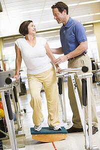 Physiotherapist With Patient In Rehabilitation