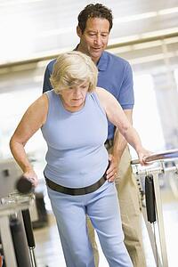 Physiotherapist With Patient In Rehabilitation