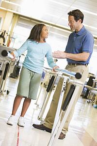 Physiotherapist With Patient In Rehabilitation