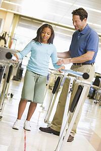 Physiotherapist With Patient In Rehabilitation