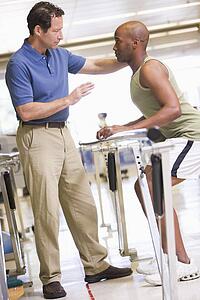 Physiotherapist With Patient In Rehabilitation