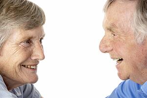 Portrait of senior couple smiling at each other