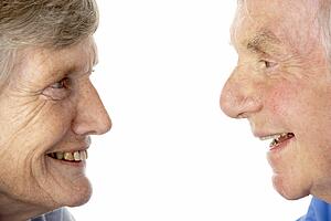 Portrait of senior couple smiling at each other