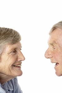 Portrait of senior couple smiling at each other