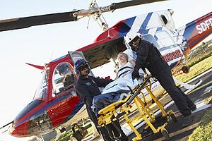 Paramedics unloading patient from Medevac