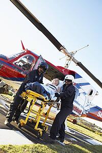 Paramedics unloading patient from Medevac