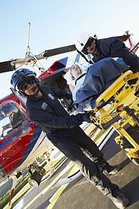 Paramedics unloading patient from Medevac