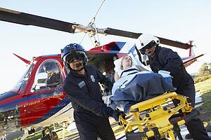 Paramedics unloading patient from Medevac