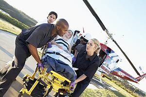 Paramedics unloading patient from Medevac