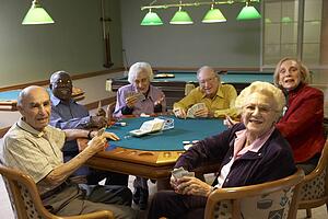 Senior adults playing bridge