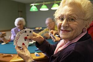 Senior adults playing bridge