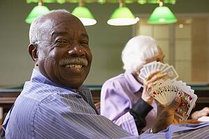 Senior man playing bridge