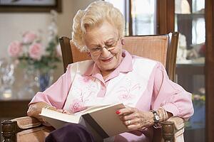 Senior woman reading book
