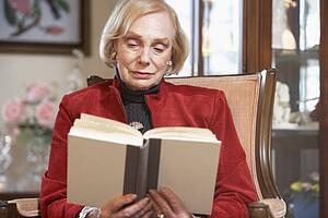 Senior woman reading book