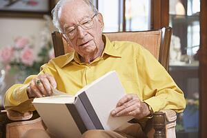 Senior man reading book
