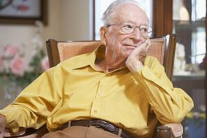 Senior man relaxing in armchair