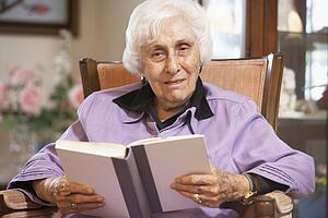Senior woman reading book