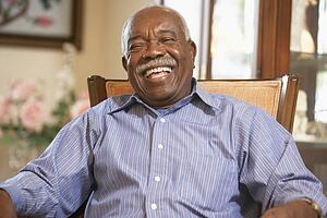 Senior man relaxing in armchair