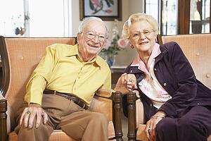 Senior couple holding hands