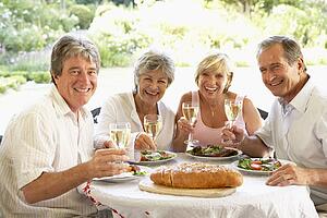 Friends Eating An Al Fresco Lunch, Holding Wineglasses