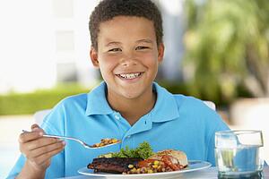 Young Boy Dining Al Fresco