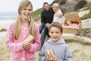 Family Dining Al Fresco At The Beach