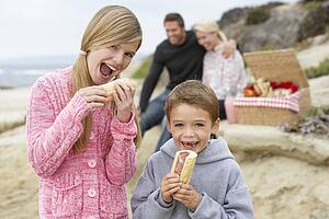 Family Dining Al Fresco At The Beach