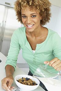 Mid Adult Woman Eating Healthy Breakfast