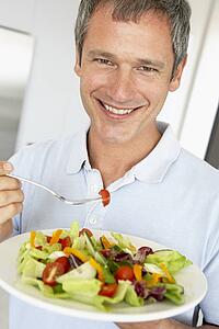 Middle Aged Man Eating A Healthy Salad