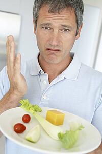 Middle Aged Man Holding A Plate Of Fresh And Healthy Food