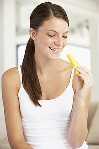 Young Woman Eating Fresh Pineapple