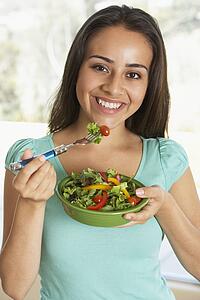 Teenage Girl Eating A Salad