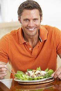 Middle Aged Man Eating A Healthy Meal