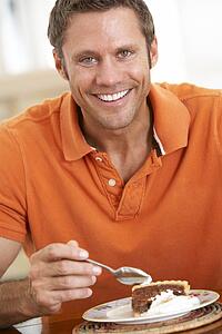 Middle Aged Man Eating Chocolate Cake