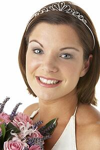 Portrait Of Bride Holding Bouquet Of Flowers