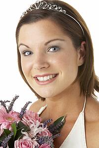 Portrait Of Bride Holding Bouquet Of Flowers