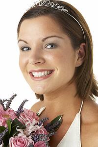 Portrait Of Bride Holding Bouquet Of Flowers