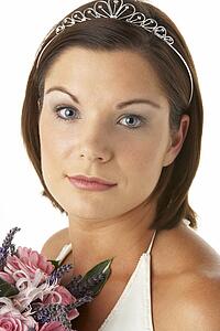 Portrait Of Bride Holding Bouquet Of Flowers