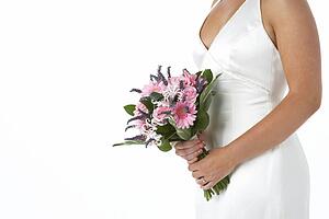 Bride Holding Bouquet Of Flowers