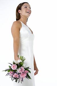 Portrait Of Bride Holding Bouquet Of Flowers