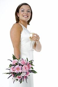 Portrait Of Bride Holding Bouquet And Wine Glass