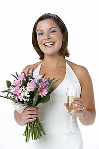Portrait Of Bride Holding Bouquet And Wine Glass