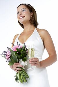 Portrait Of Bride Holding Bouquet And Wine Glass