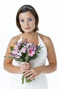 Bride Holding Bouquet And Crying