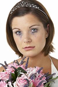 Bride Holding Bouquet And Crying
