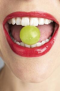 Woman Biting Grape