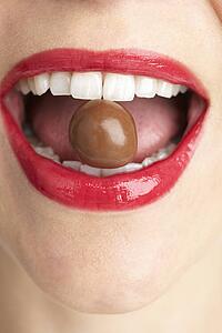 Woman Biting Chocolate
